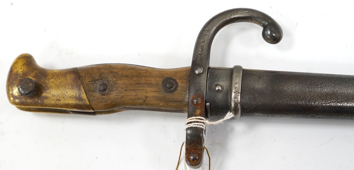 An 1880 French bayonet and scabbard for a Gras rifle. Condition - good, some pitting